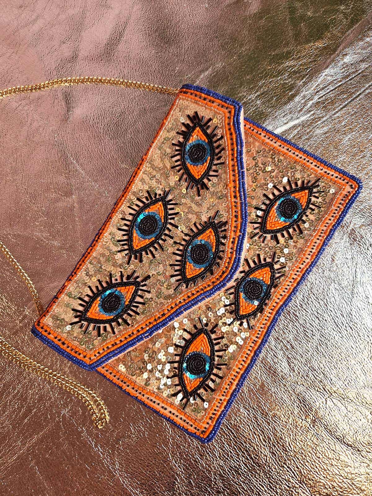 perleclutch med øjne - rosa og blå