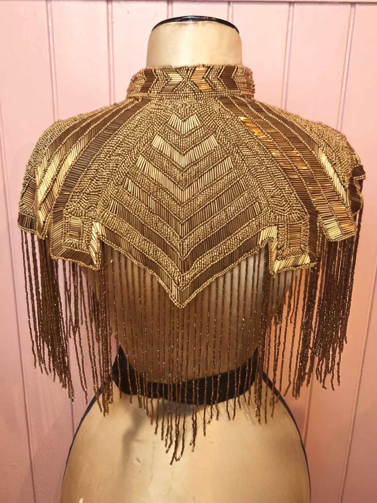 perlekappe guldfarvet kort - ryg