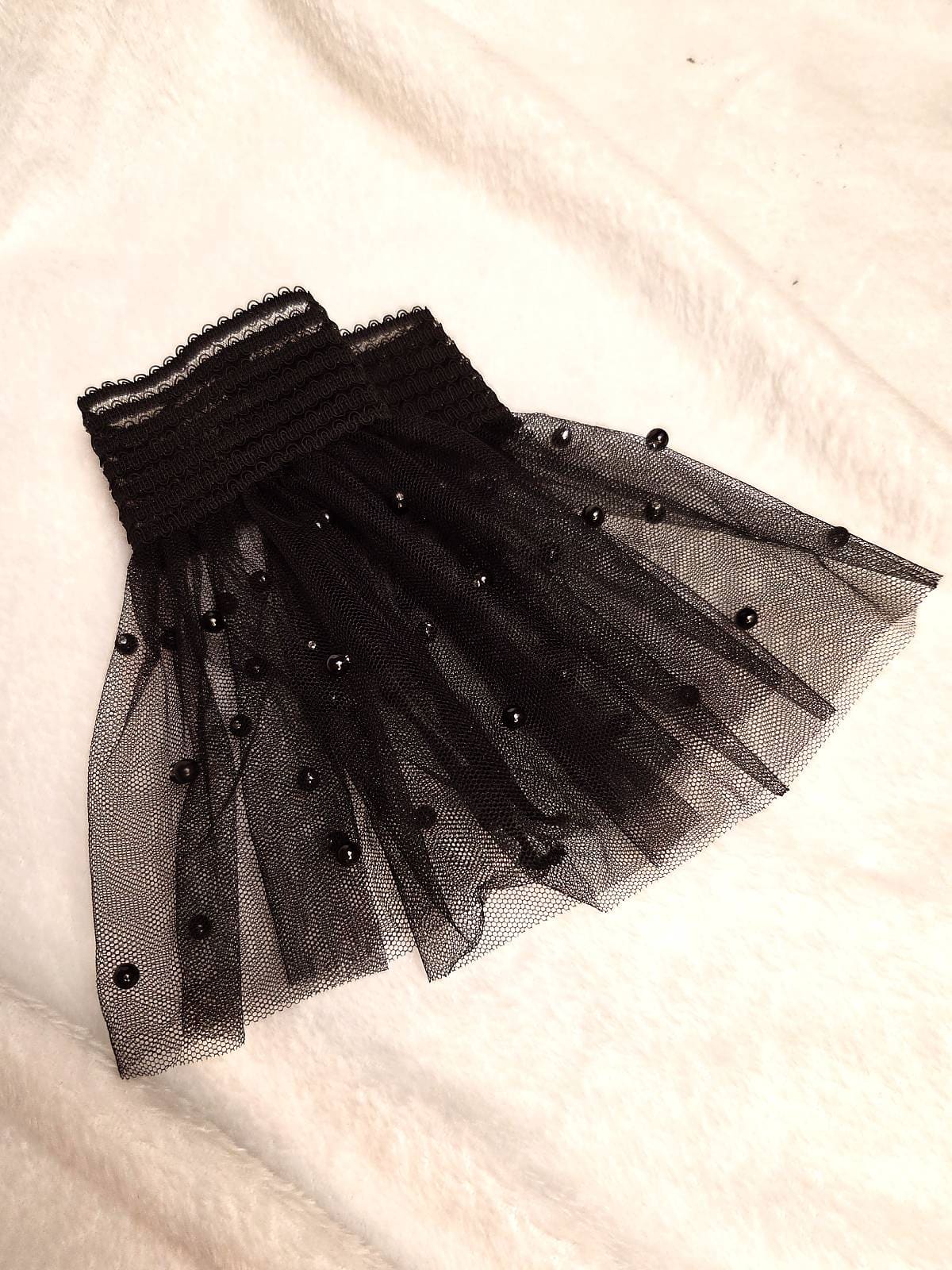 manchetter sorte perler