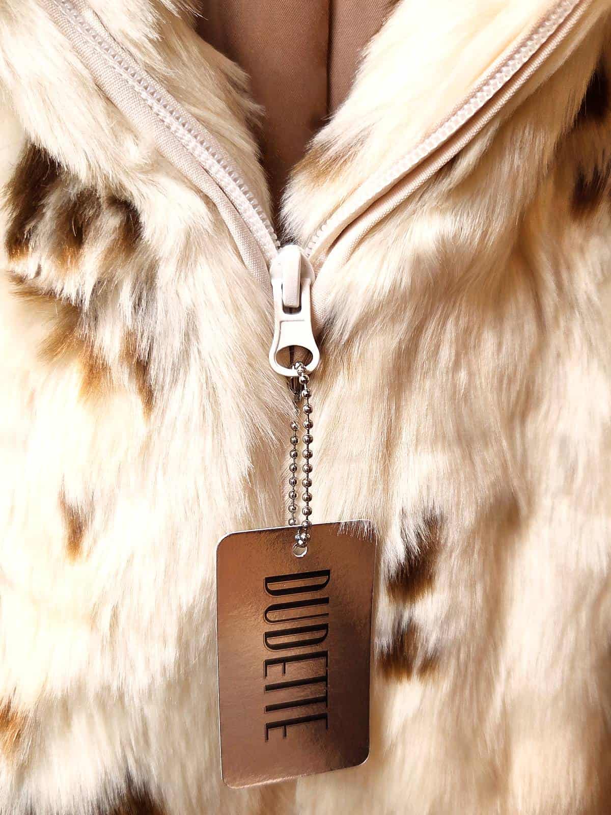 faux fur cow pels kort lynlås