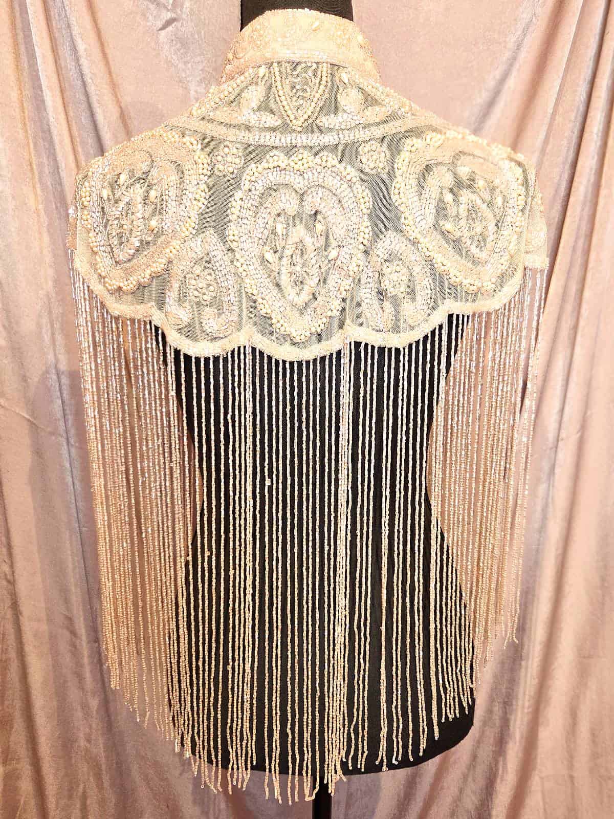 Perlekappe gammelrosa ryg