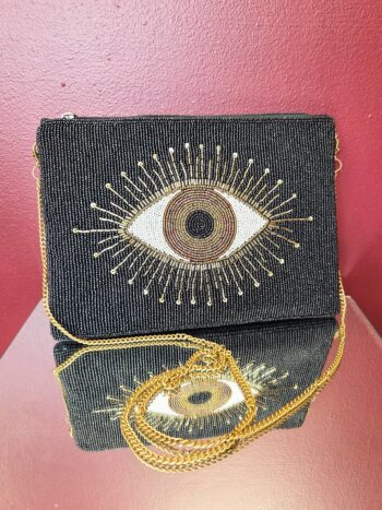 Evil Eye clutch bag med sort og orange design, perfekt til tilbehør og beskyttelse.
