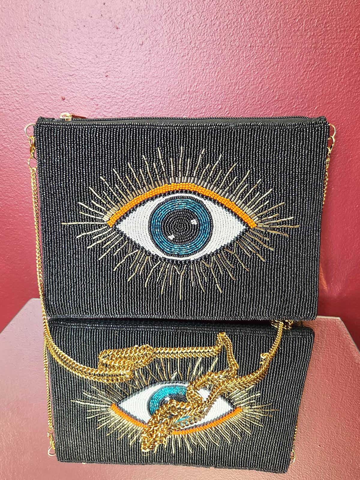 perleclutch eye sort og orange